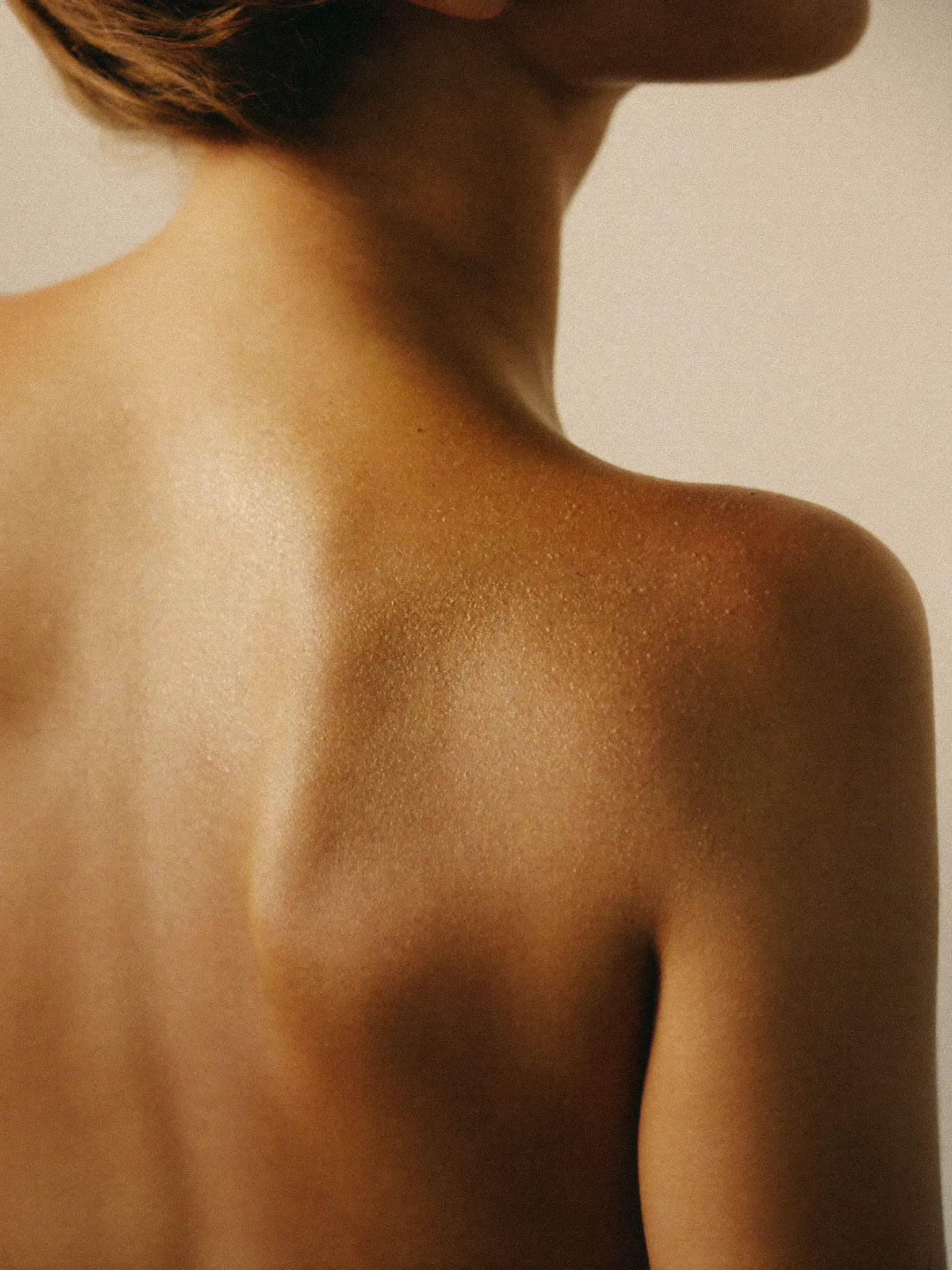 A bronzed glow over the shoulder