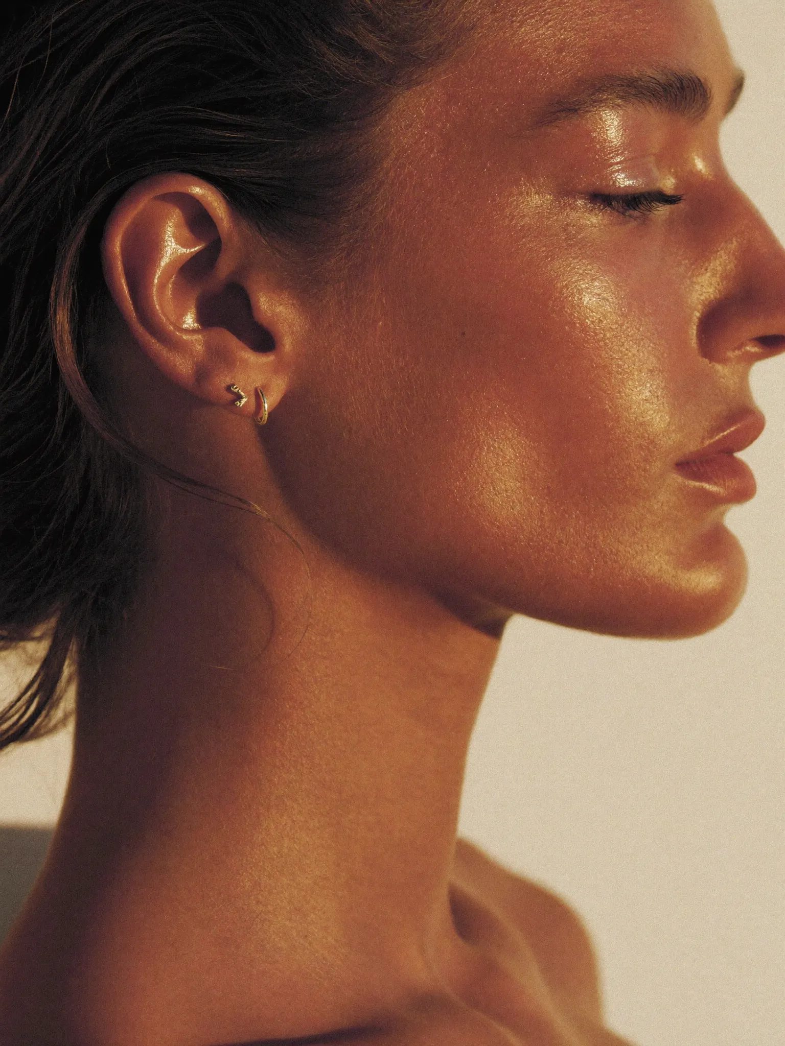 A sun-kissed profile with a gold earring